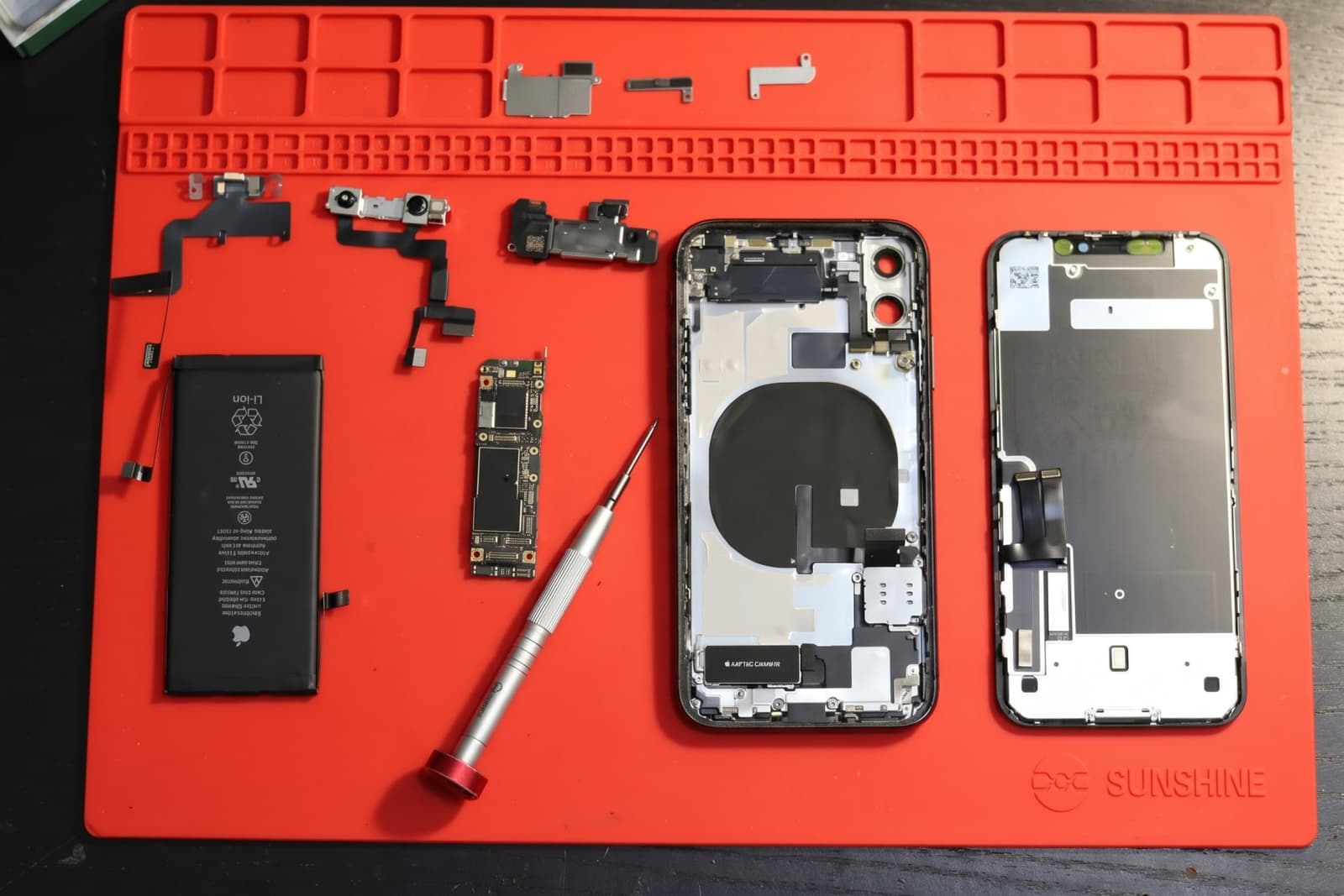 Smartphone with a cracked screen ready for repair