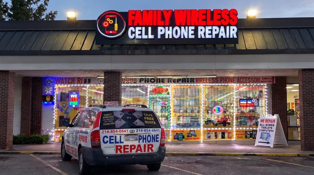 Family Wireless Cell Phone Repair storefront in Dallas at dusk